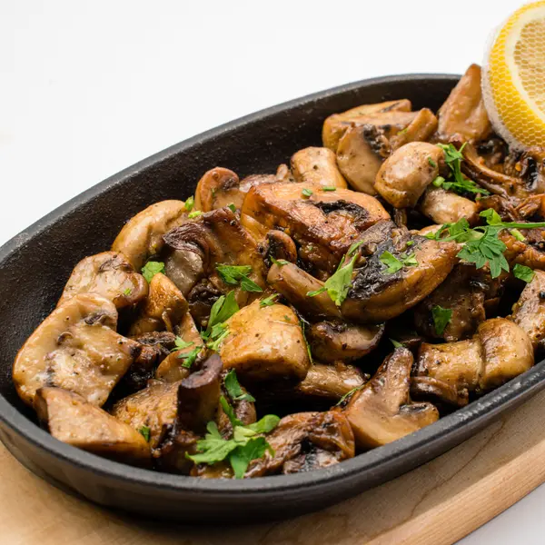 concept-food-cafe-bar - A portion of porcini mushrooms