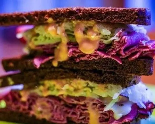 east-side-delicatessen - Corned Beef Reuben on Dark Rye Sandwich